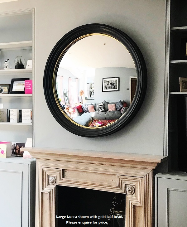 image extra large black gold convex mirror above fireplace