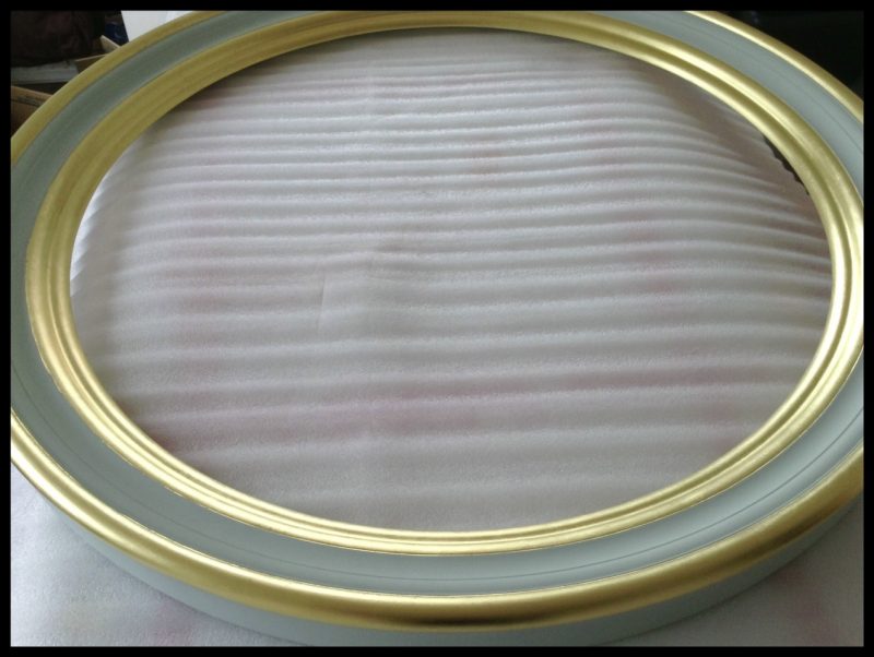Bespoke finish convex mirror designed & made by omelomirrors.com custom finish convex mirror frame in gold leaf and green paint image