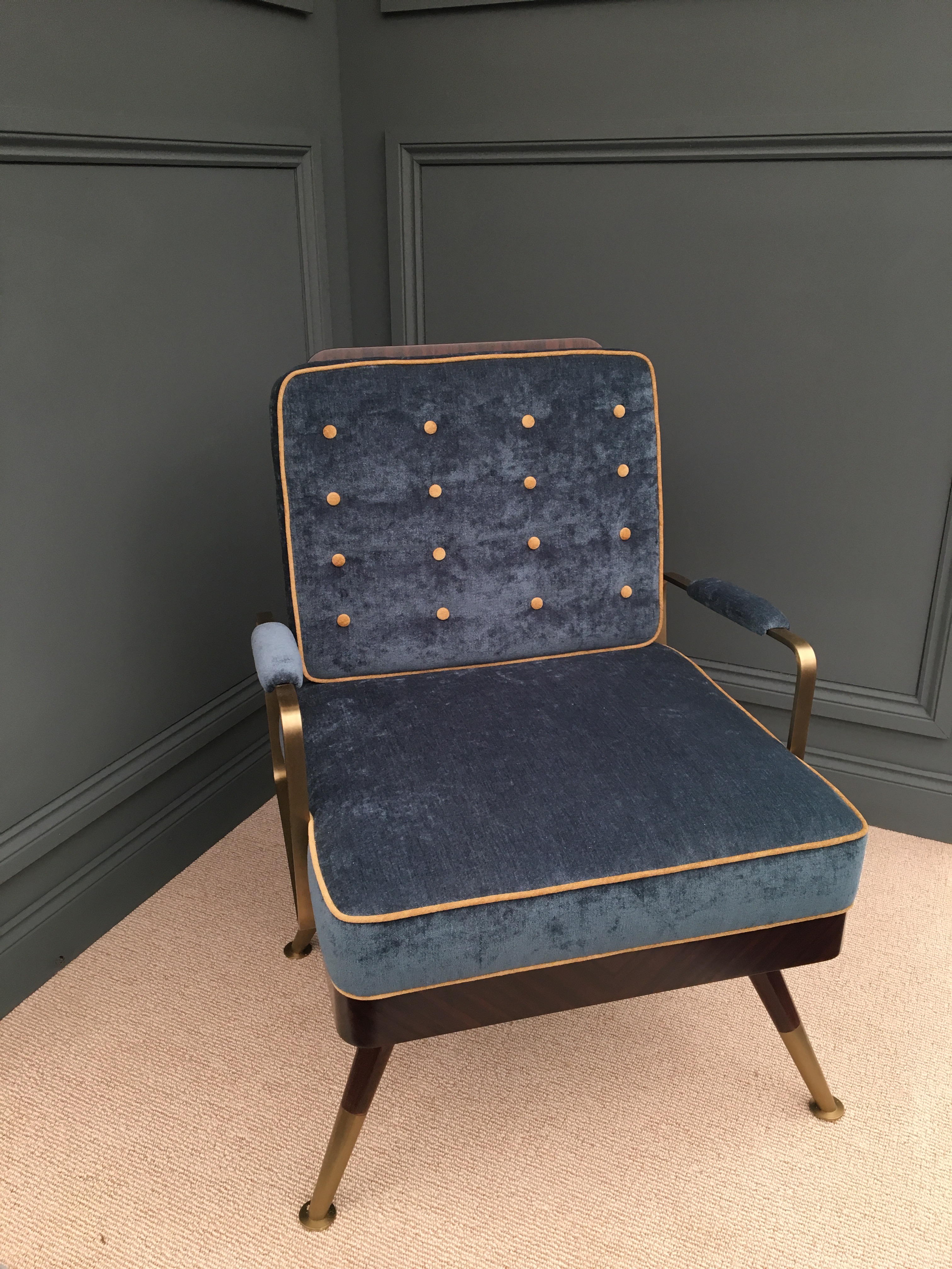 blue velvet chair with brass arms 