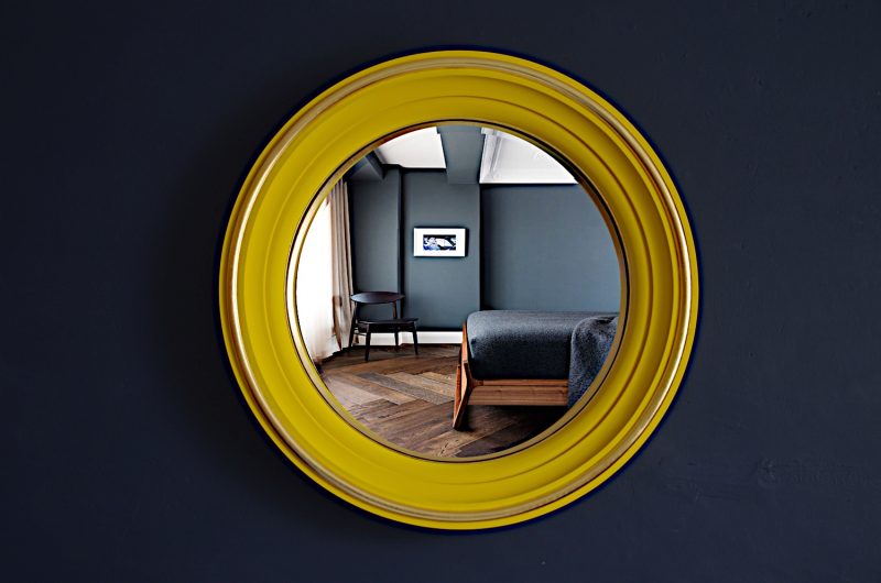 Let the sunshine into your home with a yellow wall mirror Omelo